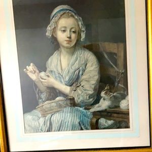 Beautiful picture of a woman and her cat knitting.